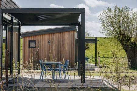 Terrace with shade cloth of a holiday home at the Roompot Park Wijdenes holiday park