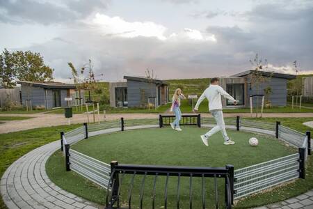 People play football in the panna cage at the Roompot Park Wijdenes holiday park