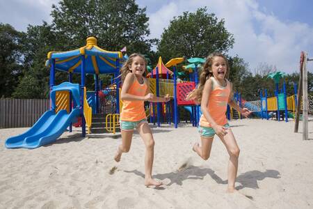 Children run in a playground at the Roompot Resort Arcen holiday park