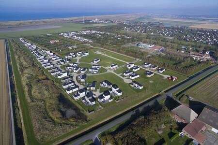 Aerial view of holiday homes at Roompot Holiday Park Callassande and the North Sea on the horizon