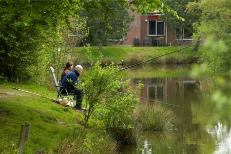 A man and woman fishing at Roompot Vakantiepark Weerterbergen