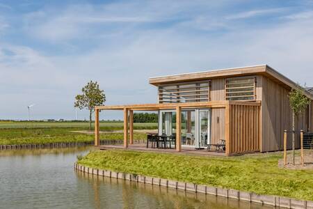 Holiday home with a terrace on the water at the Roompot Water Village holiday park