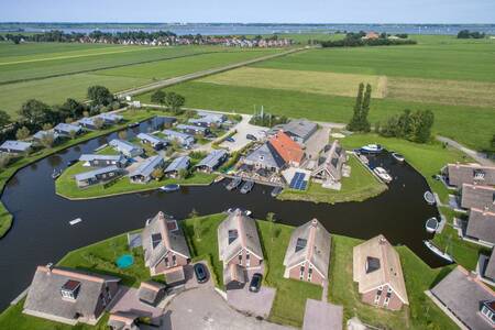 Aerial view of holiday homes on the water at the Roompot Waterpark Terkaple holiday park