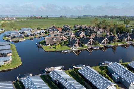 Aerial view of holiday homes on the water at the Roompot Waterpark Terkaple . holiday park