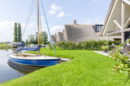 Holiday home with private jetty at the Roompot Waterpark Terkaple . holiday park