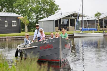 Sloop with people sailing at the Roompot Waterpark Terkaple holiday park