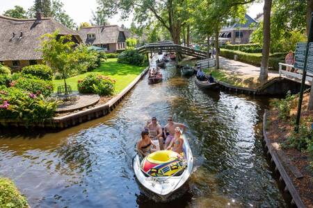 People sail through Giethoorn near the Roompot Waterstaete Ossenzijl holiday park