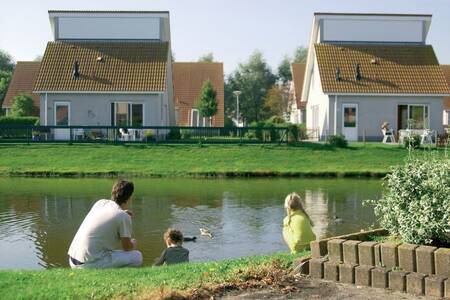 Detached holiday homes on the water at the Roompot Zeeland Village holiday park