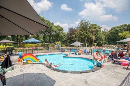 Children in the paddling pool with slide at the Topparken Landgoed de Scheleberg holiday park