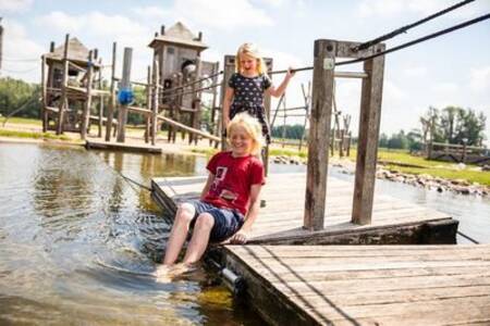 Children play in the water playground of the Topparken Recreatiepark het Esmeer