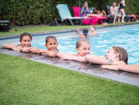 Children in the swimming pool of the Topparken Résidence De Leuvert holiday park