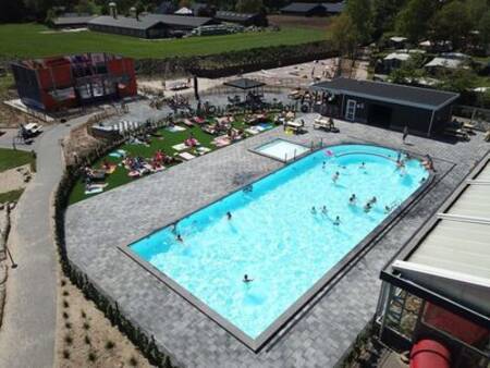 Aerial view of people in the outdoor pool of holiday park Ackersate