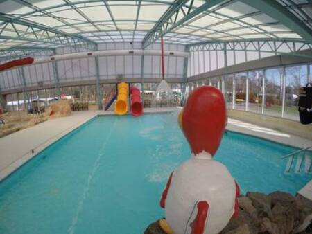 Two slides end up in the indoor pool of holiday park Ackersate