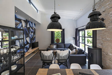 Living room and dining area of Beach Villa at Bungalow Park Campanula