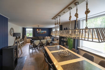 Living room and dining area of "Hoeve de hofstee" at Bungalow Park Campanula