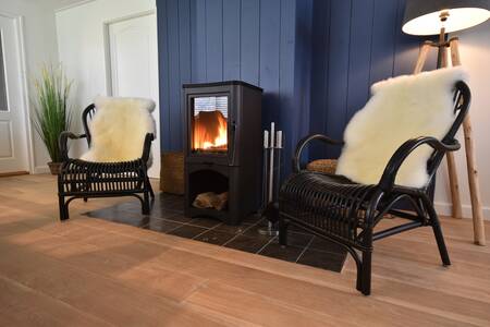Warm up by the wood stove of the Beach Villa at Bungalow Park Campanula