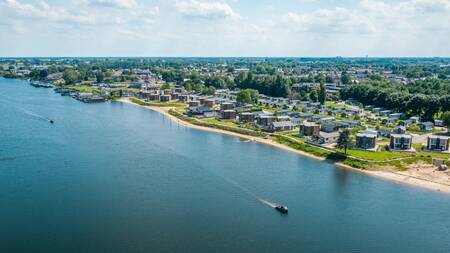 Aerial view of holiday homes on the water at the EuroParcs Aan de Maas holiday park