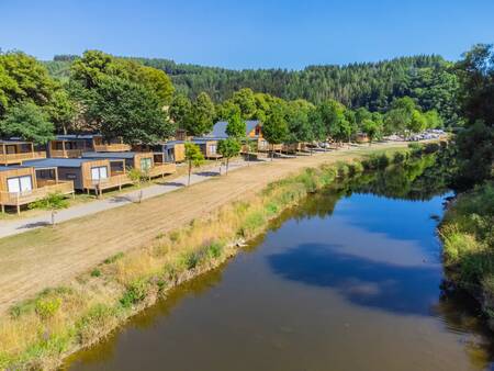 Chalets along the river Our at holiday park Europarcs Kohnenhof