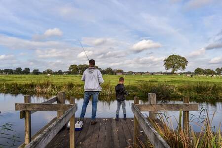 Father and son fishing at the Buitenplaats Holten holiday park